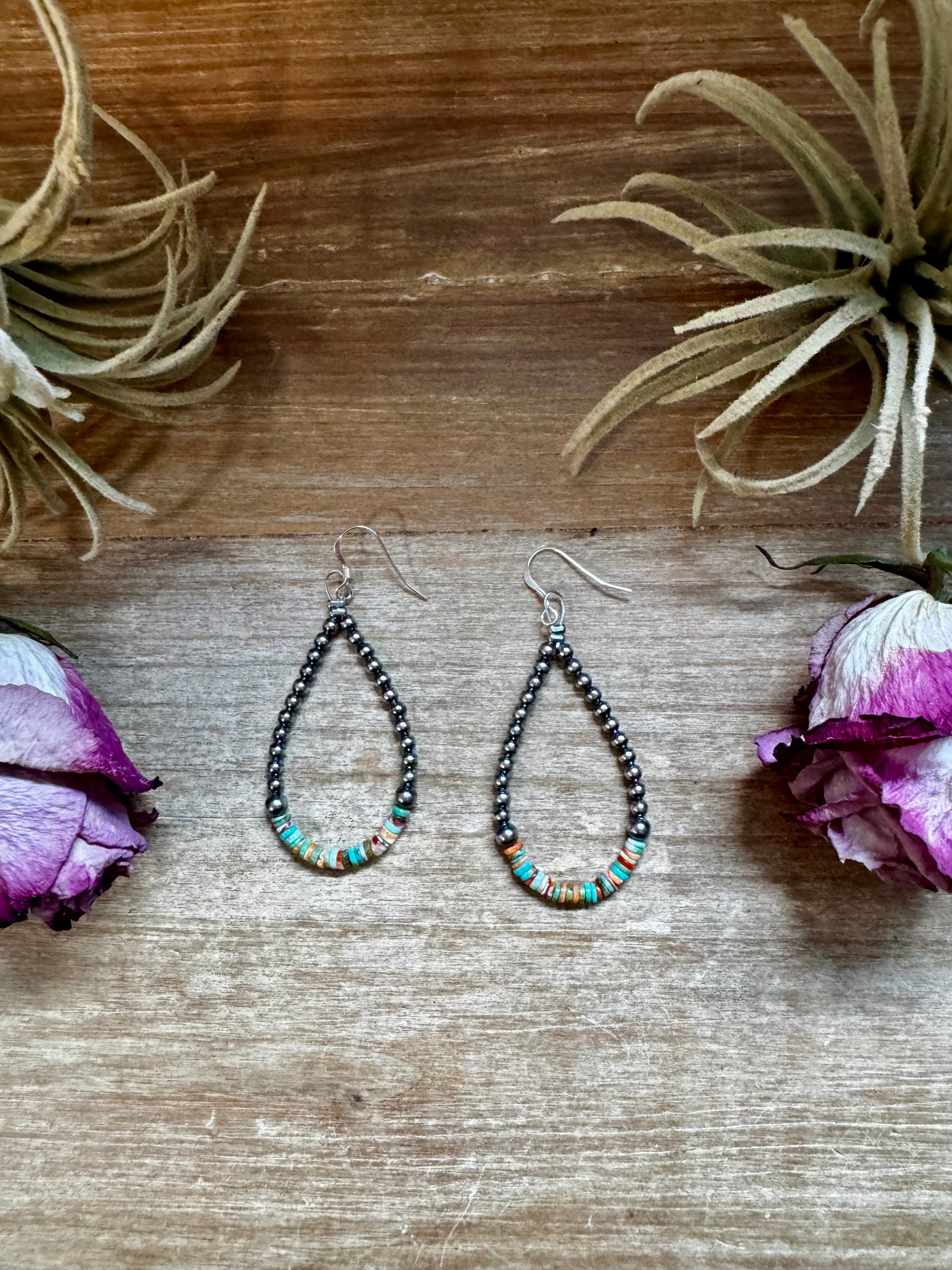 Sterling silver pearl earrings with green and orange heishi beads, handmade by The Bijoux FAB in the USA