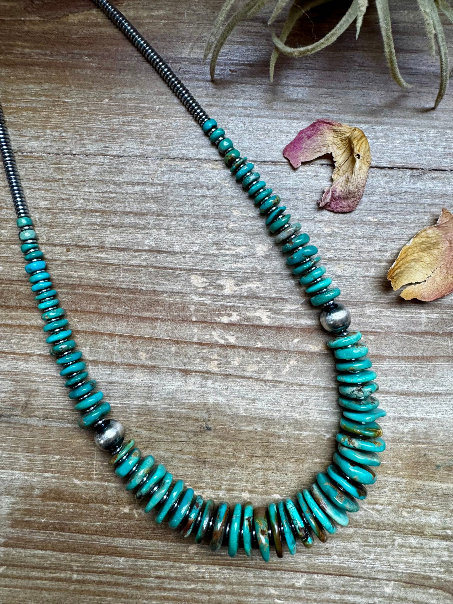 22-inch necklace featuring silver hematite beads, green turquoise stones, and 10mm sterling silver pearls. Non-tarnish hook closure. Each turquoise stone has a unique shape and color. Handmade in the USA by The Bijoux FAB.