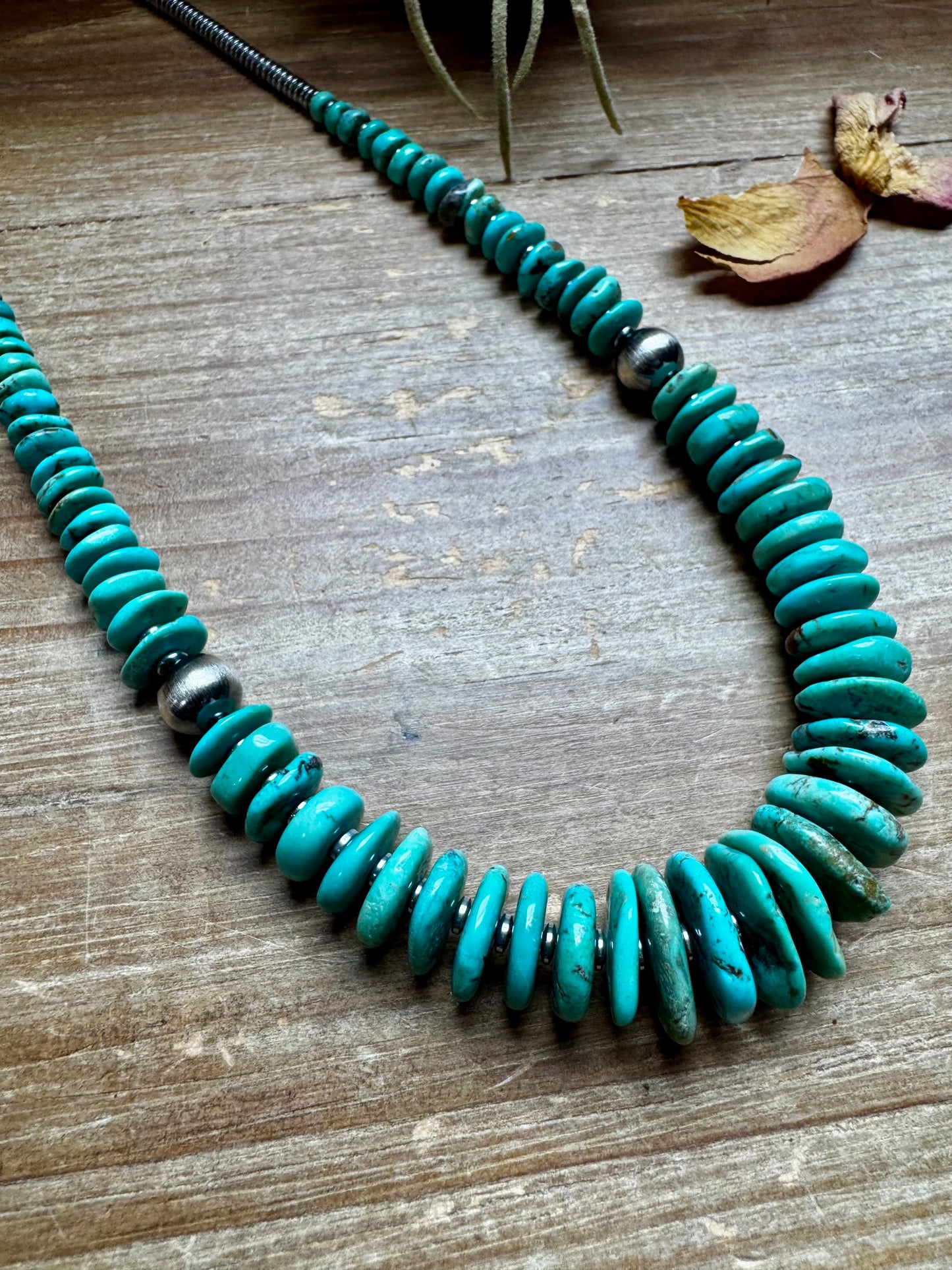 22-inch necklace featuring silver hematite beads, green-blue turquoise stones, and 10mm sterling silver pearls. Finished with a non-tarnish hook. Each turquoise stone has a unique shape and color. Handmade in the USA by The Bijoux FAB.