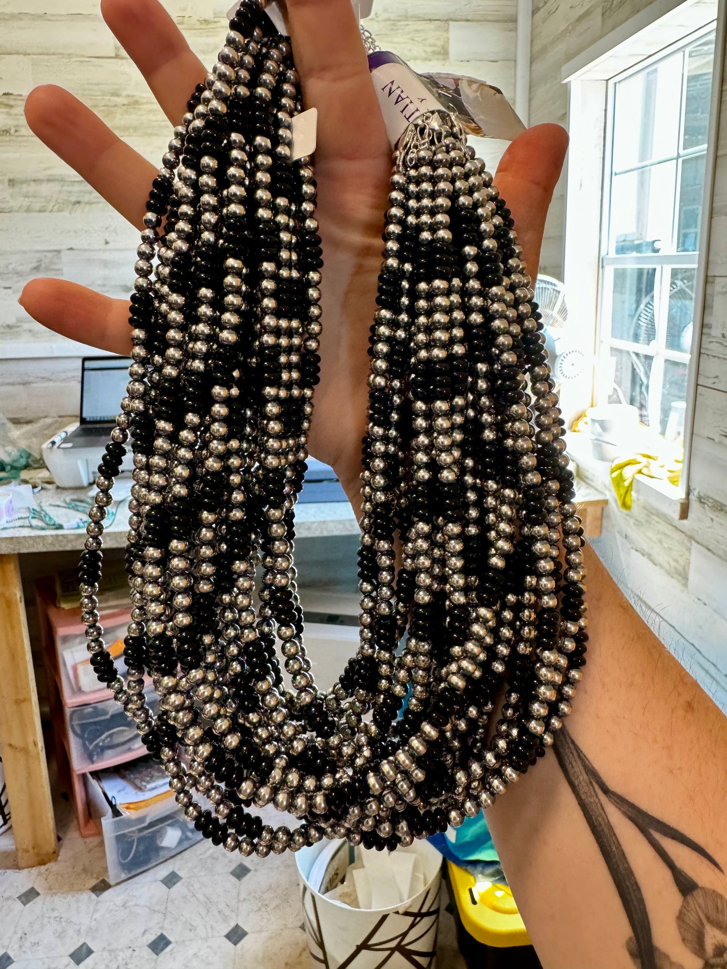 Handmade 18-inch necklace with 5mm sterling silver pearls and black onyx rondelle beads. Features a 3-inch sterling silver extender. Each piece has unique color variations. Made in the USA by The Bijoux FAB.