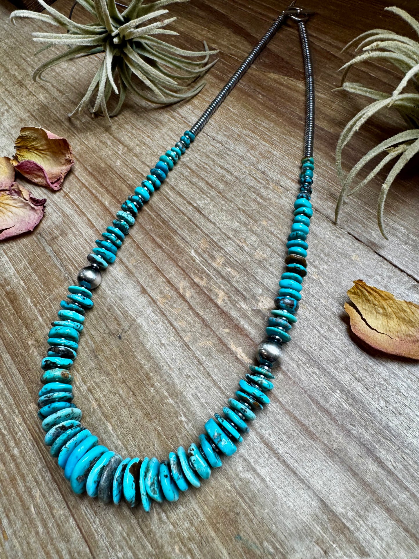 22-inch necklace featuring silver hematite beads, blue turquoise stones, and 10mm sterling silver pearls. Finished with a non-tarnish hook. Each turquoise varies in shape and color. Handmade in the USA by The Bijoux FAB.