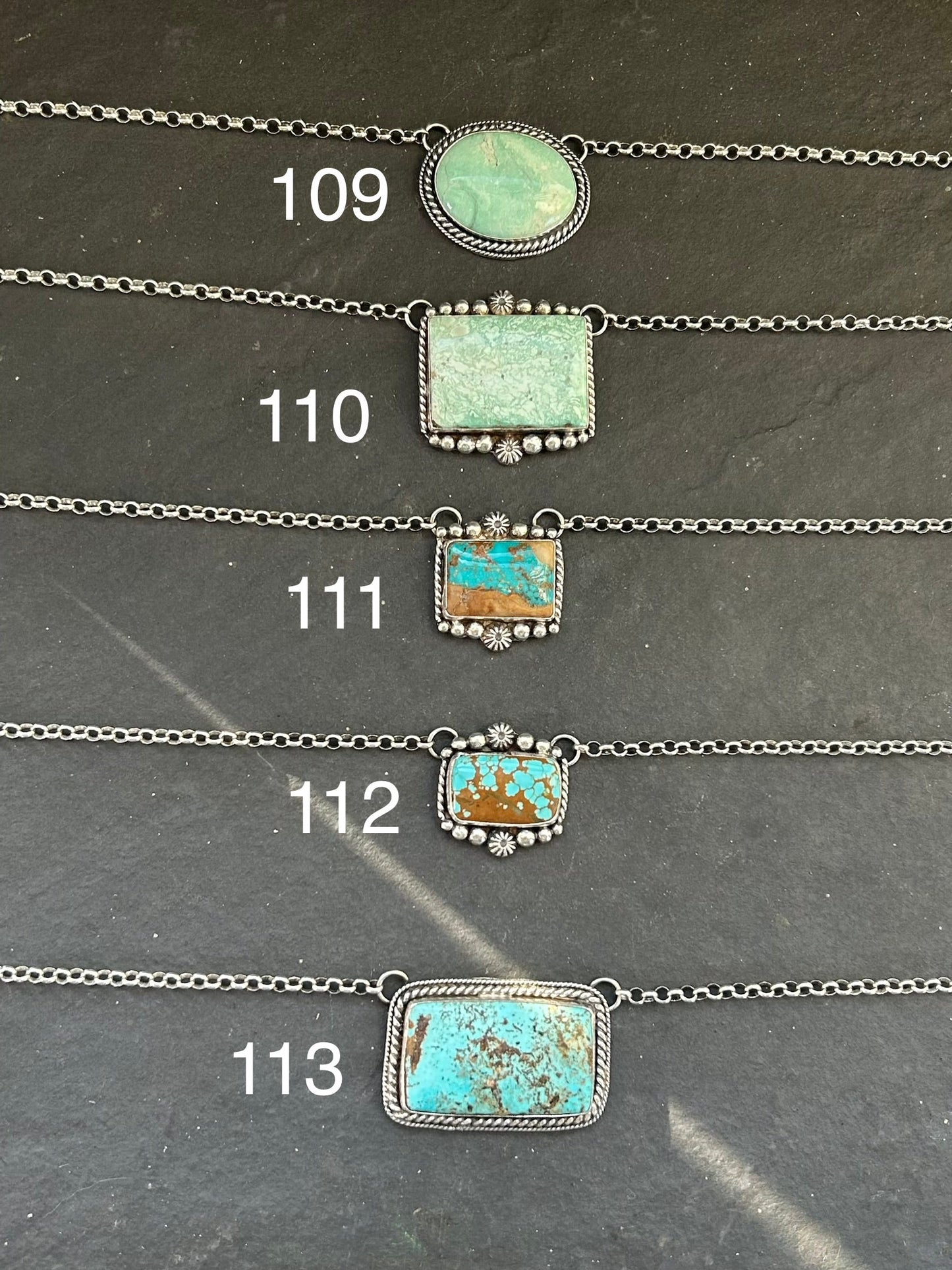 Sterling silver bar necklace with Royston turquoise and ribbon detail by artist Jason Ogg