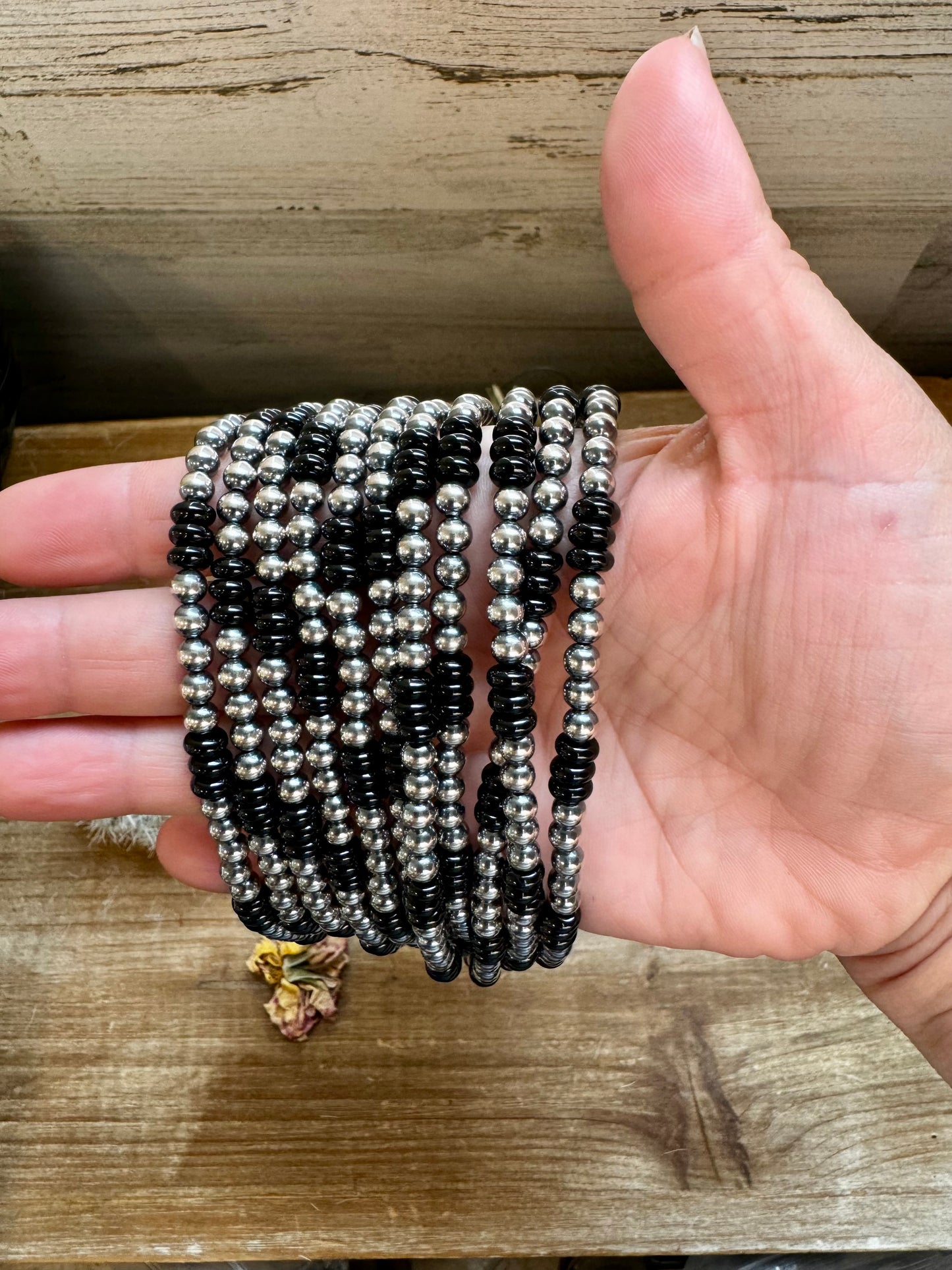 Handmade 18-inch necklace with 5mm sterling silver pearls and black onyx rondelle beads. Features a 3-inch sterling silver extender. Each piece has unique color variations. Made in the USA by The Bijoux FAB.