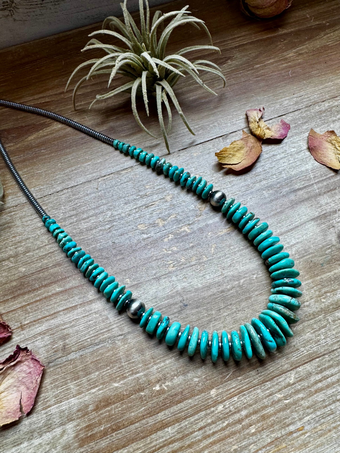22-inch necklace featuring silver hematite beads, green-blue turquoise stones, and 10mm sterling silver pearls. Finished with a non-tarnish hook. Each turquoise stone has a unique shape and color. Handmade in the USA by The Bijoux FAB.