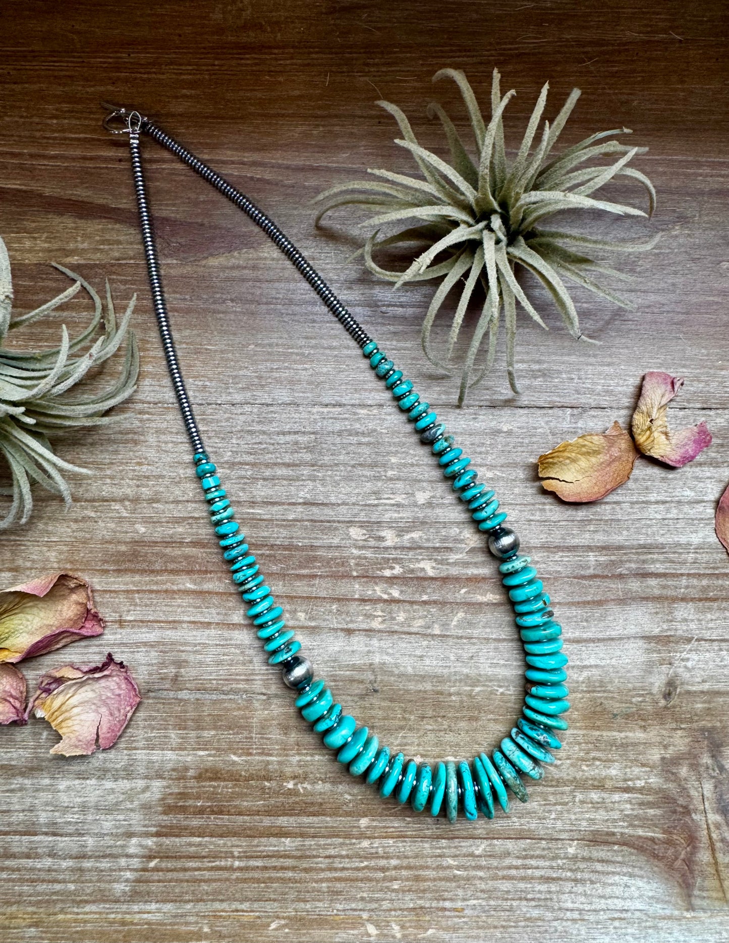 22-inch necklace featuring silver hematite beads, green-blue turquoise stones, and 10mm sterling silver pearls. Finished with a non-tarnish hook. Each turquoise stone has a unique shape and color. Handmade in the USA by The Bijoux FAB.