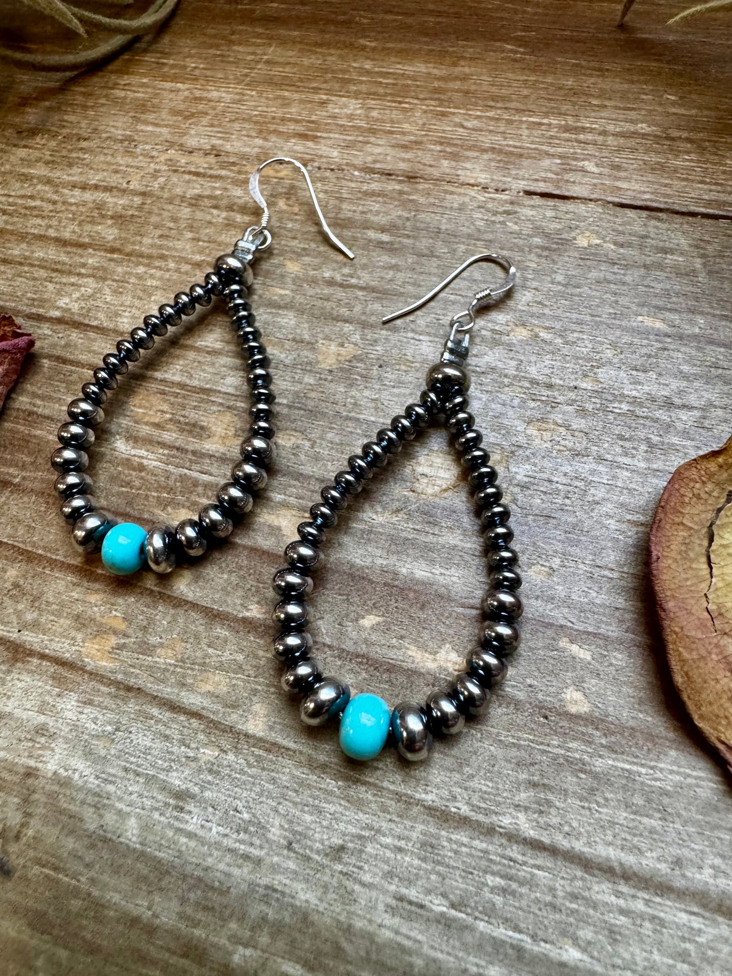 2.5-inch handmade earrings featuring 4mm, 5mm, and 6mm saucer sterling silver pearls with 6mm Mexican turquoise stones. Finished with .925 sterling silver hooks. Each turquoise stone is naturally unique. Lightweight and handcrafted in the USA by The Bijoux FAB.