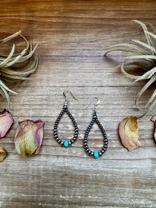 2.5-inch handmade earrings featuring 4mm, 5mm, and 6mm saucer sterling silver pearls with 6mm Mexican turquoise stones. Finished with .925 sterling silver hooks. Each turquoise stone is naturally unique. Lightweight and handcrafted in the USA by The Bijoux FAB.
