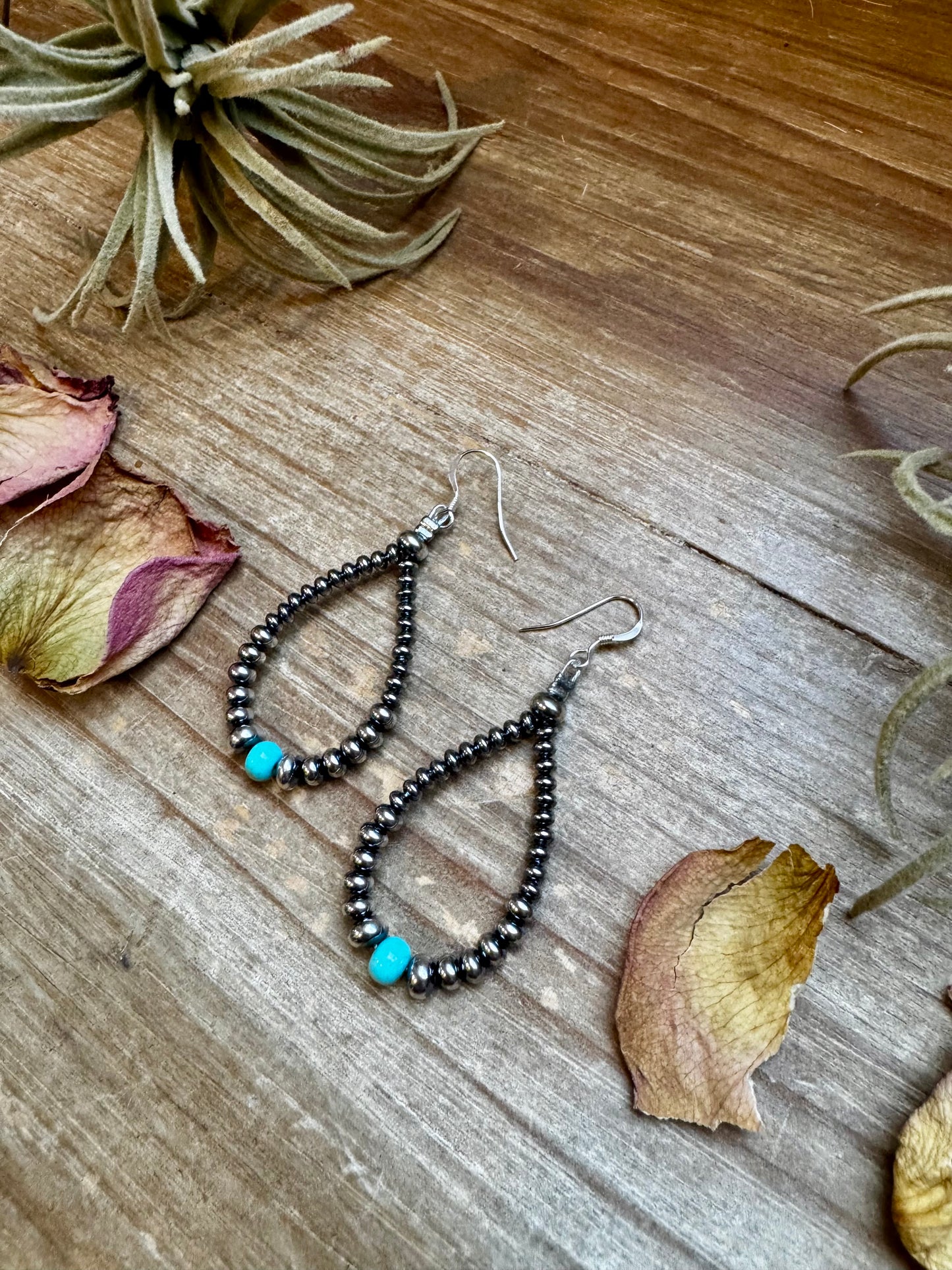 2.5-inch handmade earrings featuring 4mm, 5mm, and 6mm saucer sterling silver pearls with 6mm Mexican turquoise stones. Finished with .925 sterling silver hooks. Each turquoise stone is naturally unique. Lightweight and handcrafted in the USA by The Bijoux FAB.