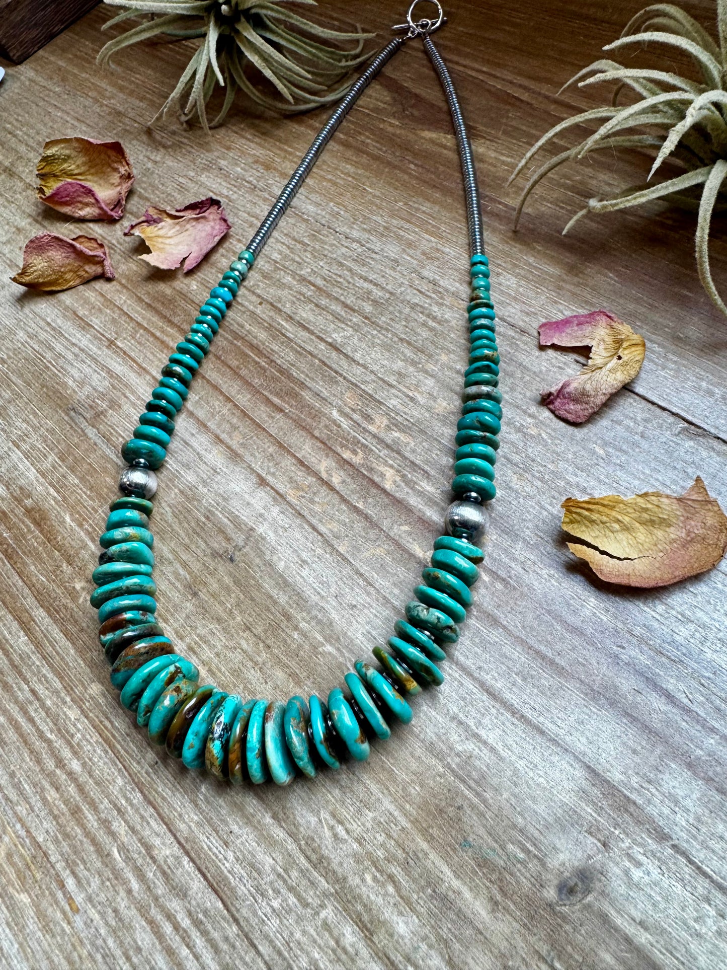 22-inch necklace featuring silver hematite beads, green turquoise stones, and 10mm sterling silver pearls. Non-tarnish hook closure. Each turquoise stone has a unique shape and color. Handmade in the USA by The Bijoux FAB.
