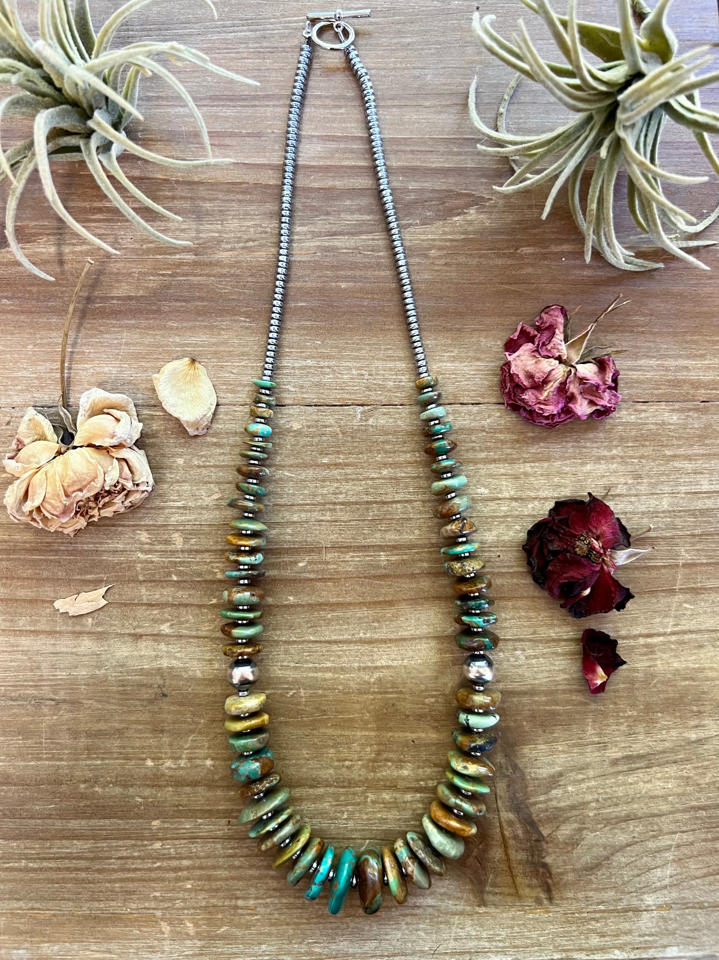 22 inch graduated turquoise necklace with Navajo pearl