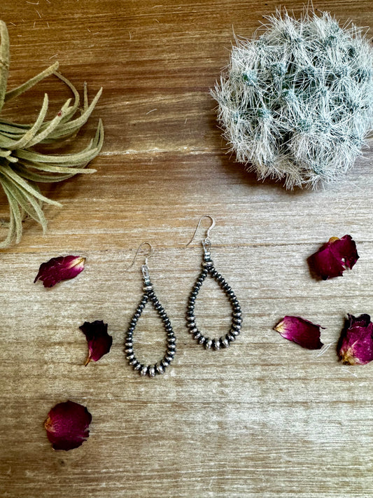 2.5-inch dangle earrings featuring 4mm, 5mm, and 6mm saucer sterling silver pearls with .925 sterling silver hooks. Handmade in the USA by The Bijoux FAB. Lightweight and easy to wear.