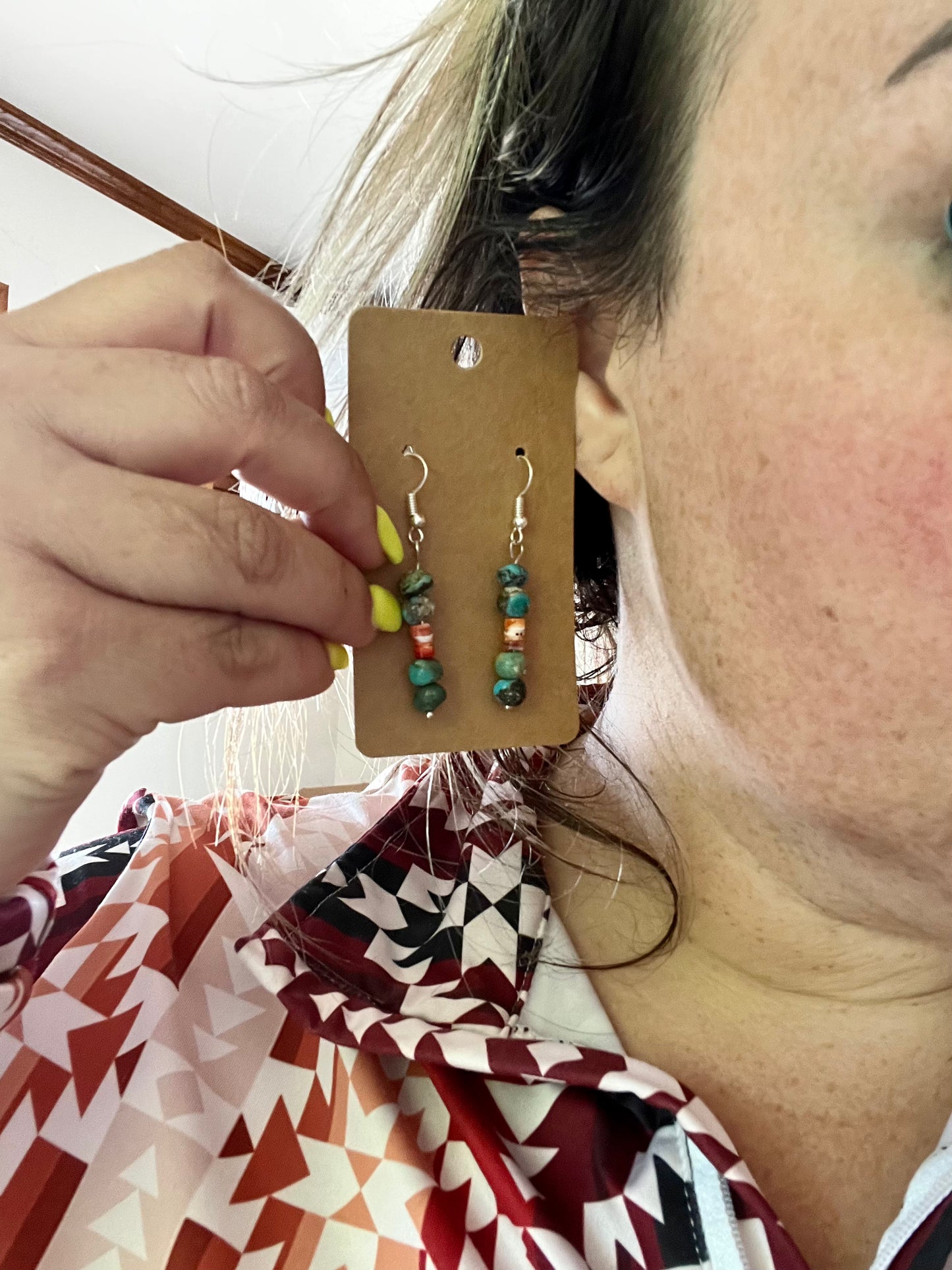 Red and blue earrings dangle real turquoise