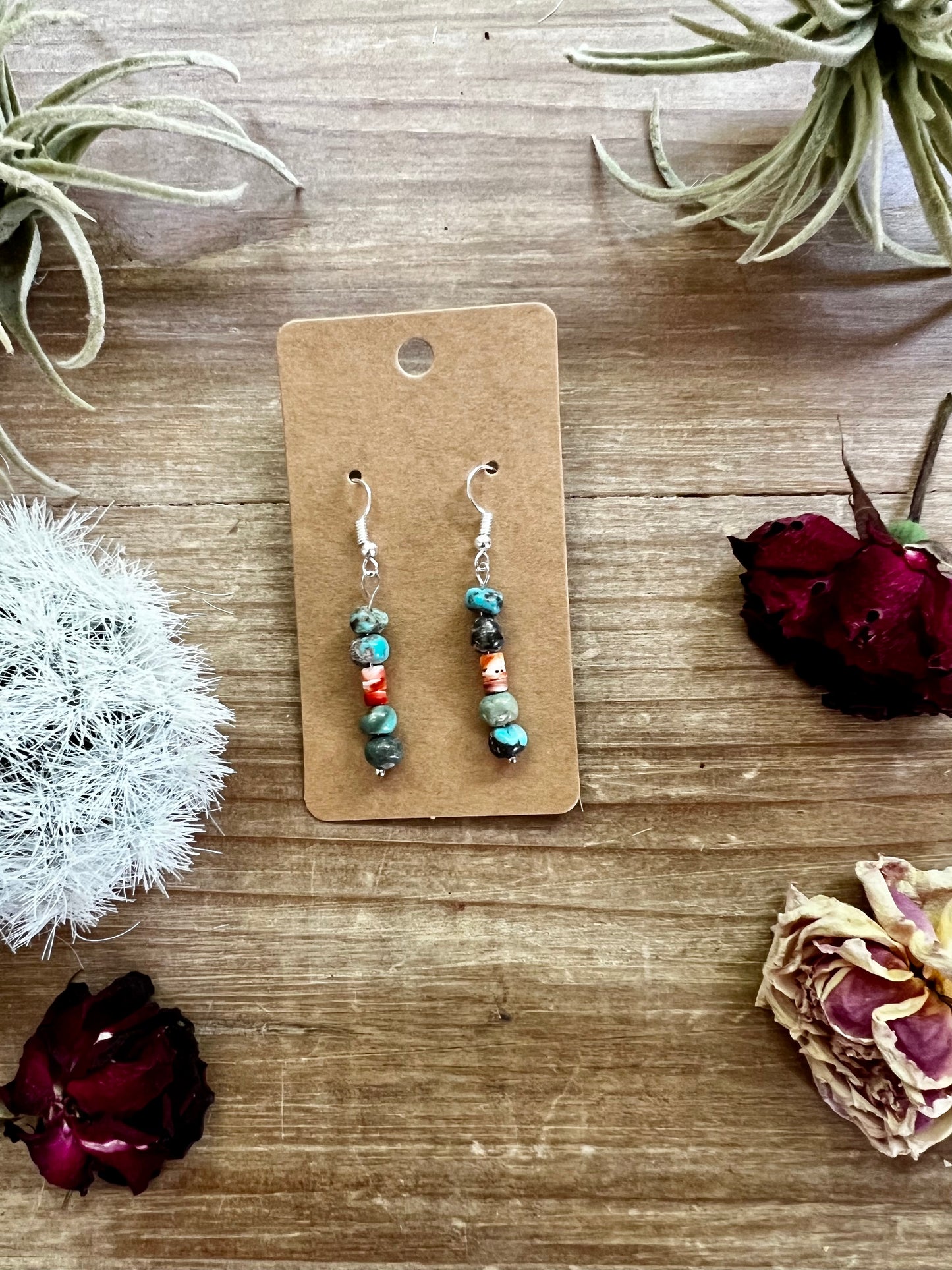 Red and blue earrings dangle real turquoise