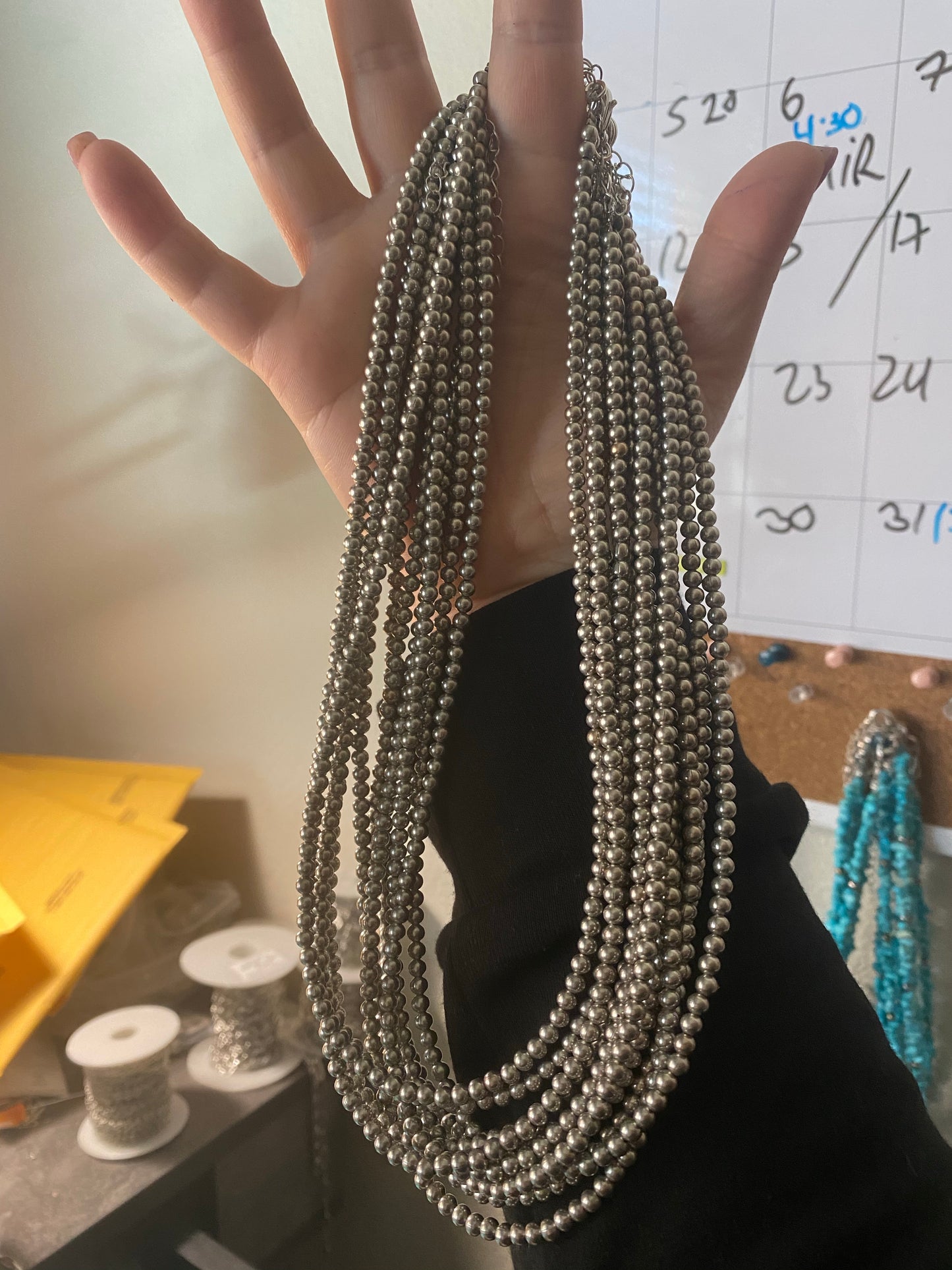 Close-up of an 18-inch necklace with 3-inch chain extender, made with 4mm silver-plated beads. Handmade in the USA by The Bijoux FAB. Sold separately. Ideal for layering or wearing solo.