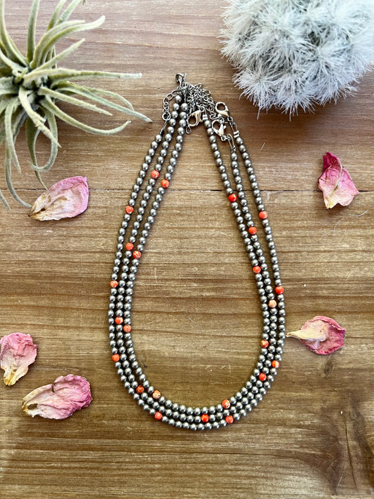 14-inch necklace with 3-inch extender, featuring 4mm silver-plated beads and orange magnesite accents. Handmade in the USA by The Bijoux FAB. Sold separately.
