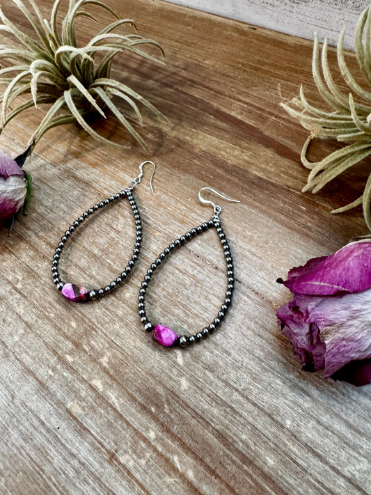 3-inch sterling silver teardrop earrings with dyed pink turquoise center bead, handmade by The Bijoux FAB in the USA