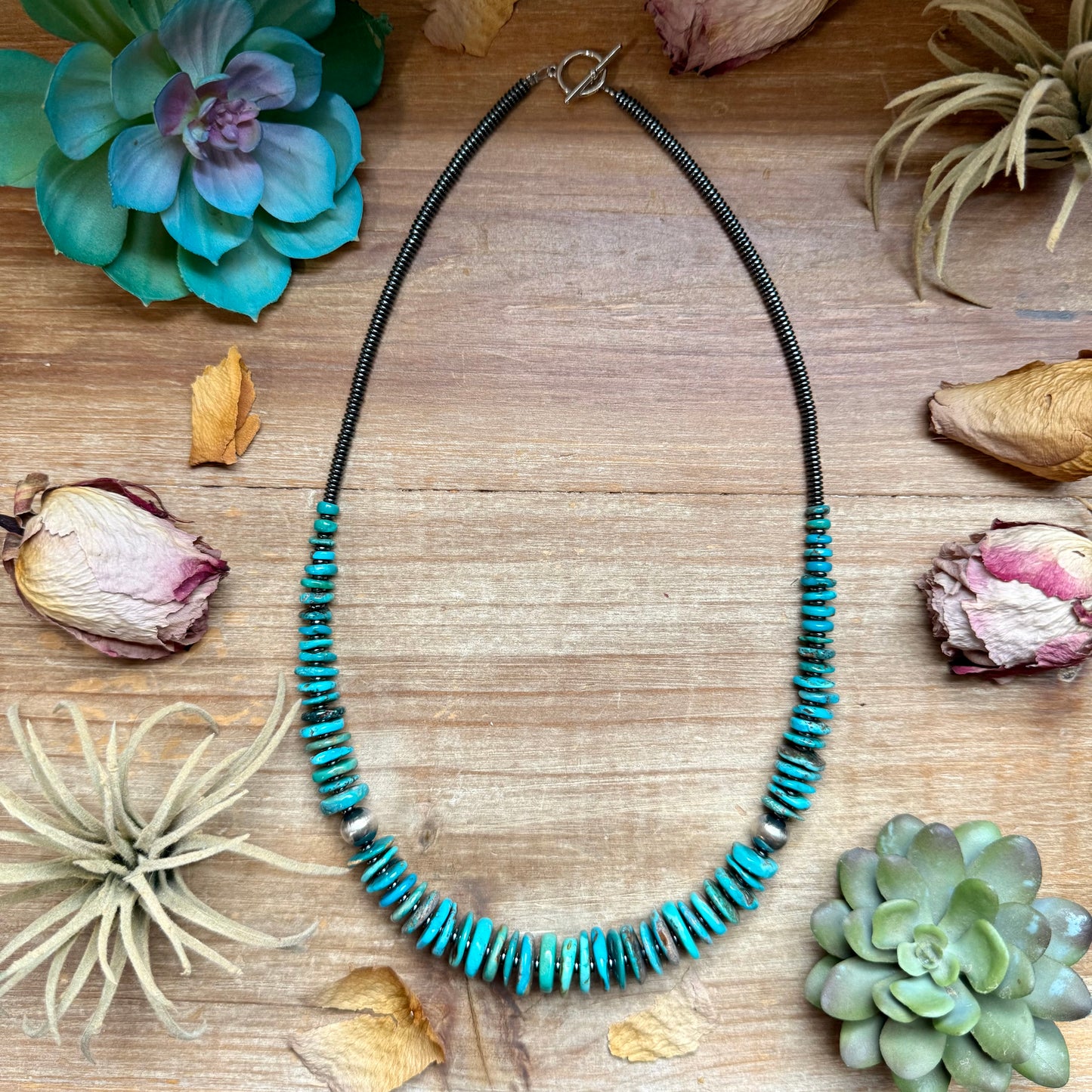 23 inch graduated dark blue turquoise necklace with dark silver hematite spacers and 10mm sterling silver pearls handmade in the USA
