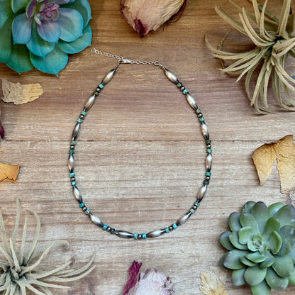 Handcrafted 14-inch choker featuring blue-green turquoise heishi beads, 4mm sterling silver pearls, and sterling silver torpedo beads with extender, made by The Bijoux FAB.