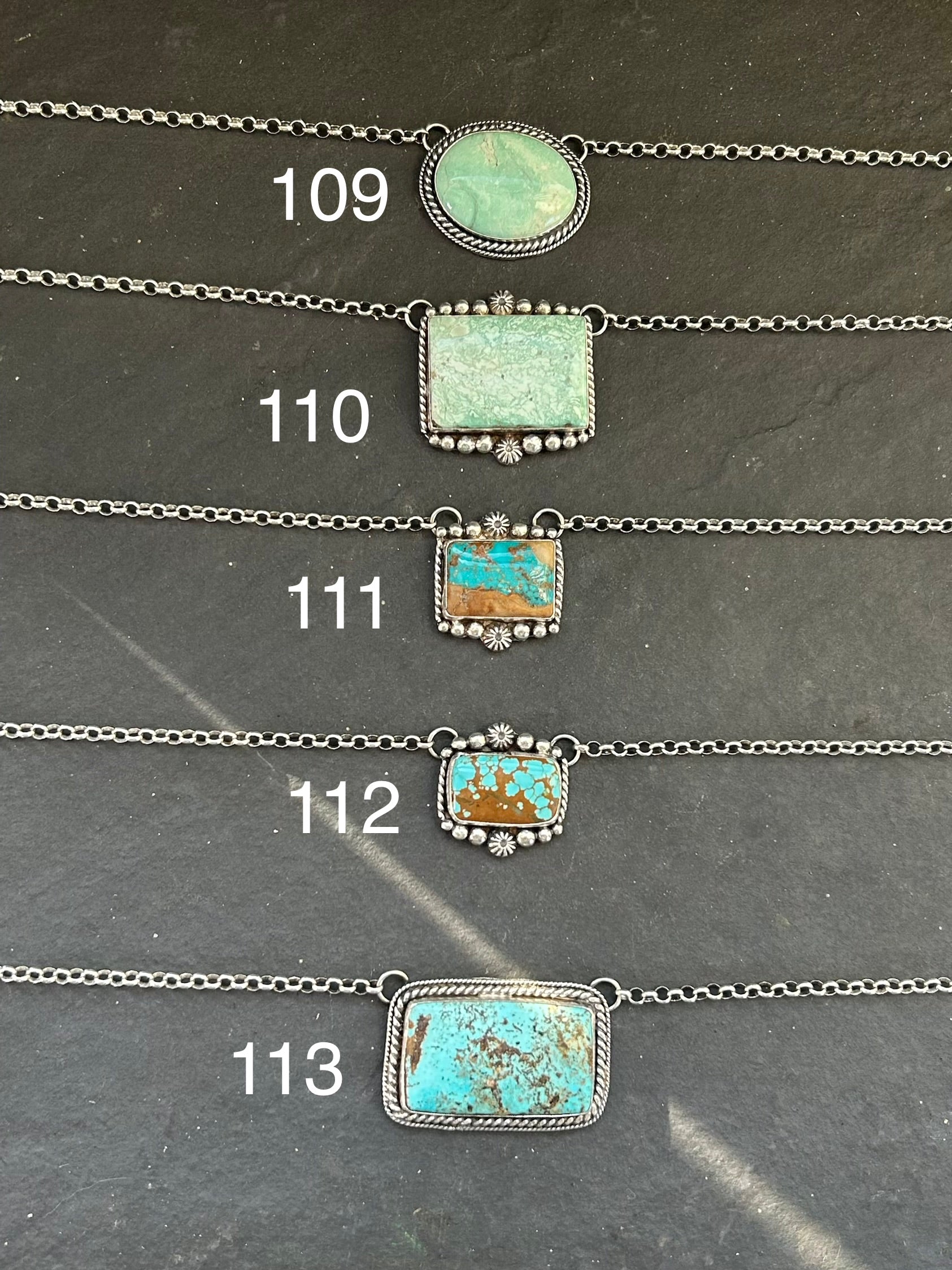 Sterling silver bar necklace with Royston turquoise and ribbon detail by artist Jason Ogg


