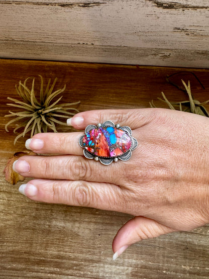 Adjustable sterling silver ring with pink dahlia oval stone, handmade by Navajo artist Tia Long, made in USA
