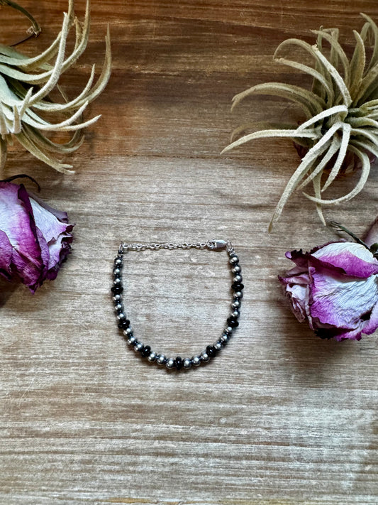 Sterling silver pearl bracelet with 6mm black onyx rondelle accent, handmade by The Bijoux FAB in the USA