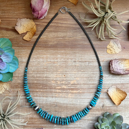23 inch dark blue turquoise graduated necklace with sterling silver pearls and hematite saucers, handmade by The Bijoux FAB
