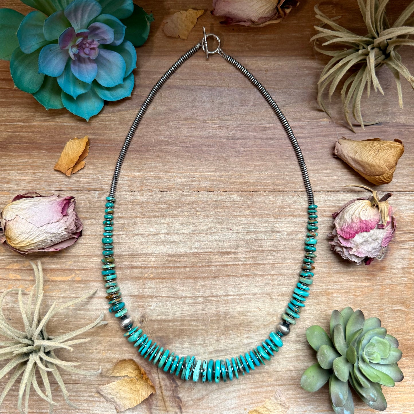 23 inch graduated turquoise necklace with blue and green tones, hematite saucer spacers, and 10mm sterling silver pearls handmade in the USA