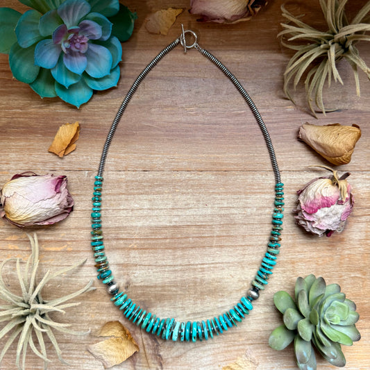 23 inch graduated turquoise necklace with blue and green tones, hematite saucer spacers, and 10mm sterling silver pearls handmade in the USA