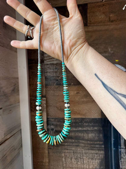 22-inch necklace featuring silver hematite beads, green turquoise stones, and 10mm sterling silver pearls. Non-tarnish hook closure. Each turquoise stone has a unique shape and color. Handmade in the USA by The Bijoux FAB.