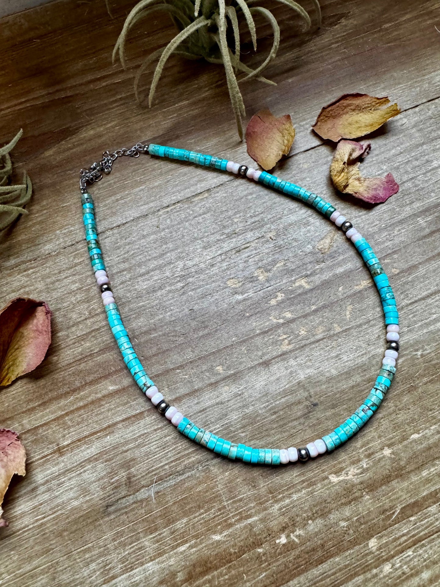 Handmade 14-inch choker with 3-inch extender, featuring 4mm turquoise variscite, pink conch, and sterling silver beads. Finished with silver-plated findings. Made in North Texas and exclusive to The Bijoux FAB. Matching earrings available.