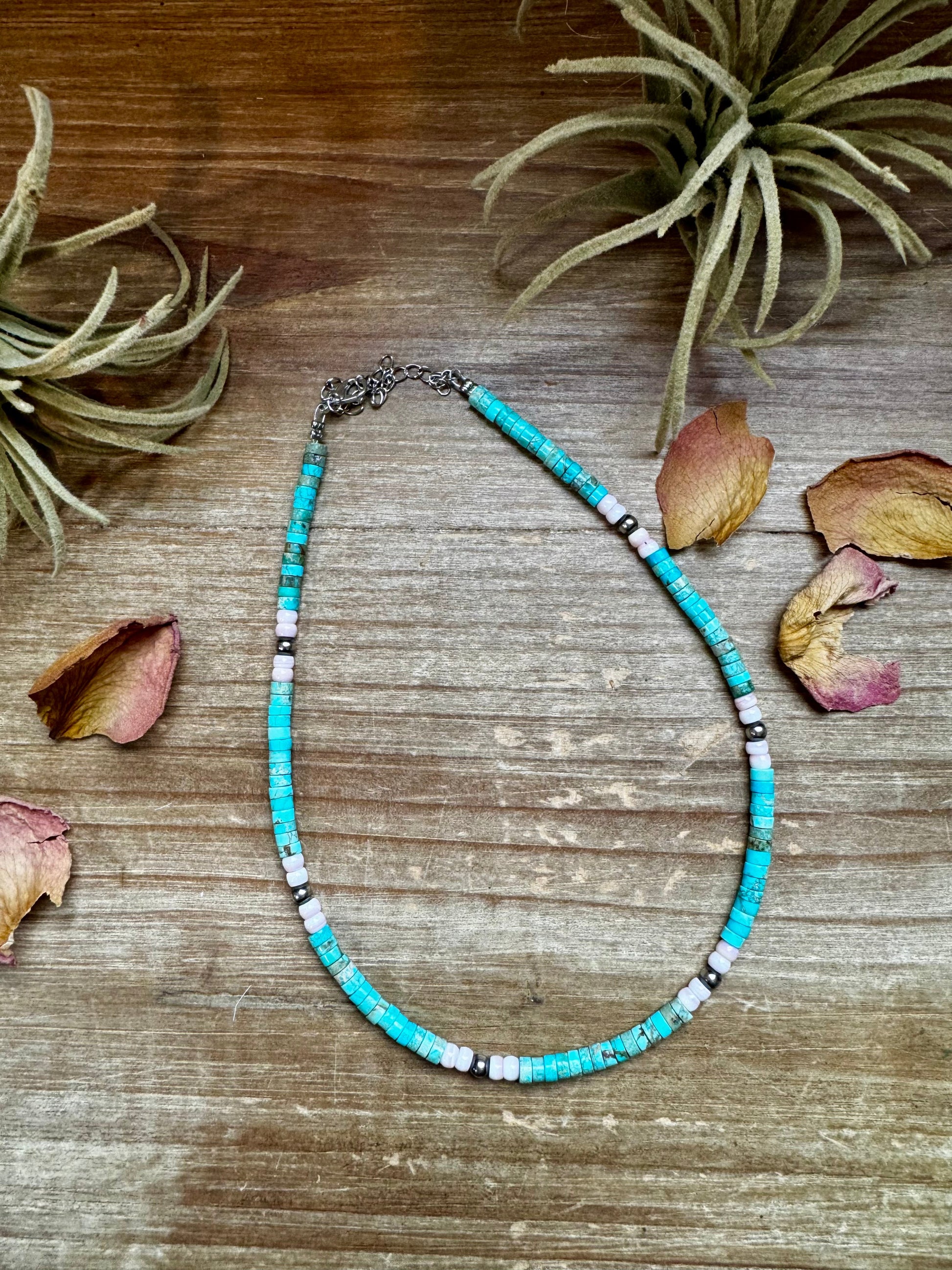 Handmade 14-inch choker with 3-inch extender, featuring 4mm turquoise variscite, pink conch, and sterling silver beads. Finished with silver-plated findings. Made in North Texas and exclusive to The Bijoux FAB. Matching earrings available.