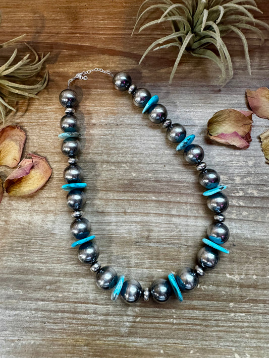 One-of-a-kind 17-inch necklace with 16mm sterling pearls, 10mm saucers, and 20mm turquoise heishi beads, finished with sterling chain and lobster clasp