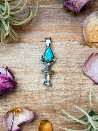 Sterling silver blossom pendant with 8 mm Sonoran Gold turquoise, Native made by artist M with arrow stamp, handmade in USA