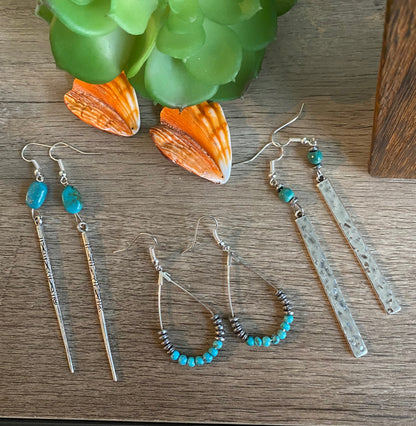 Earrings dangle with turquoise